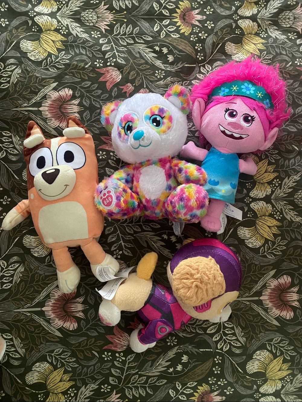 Four plush characters
